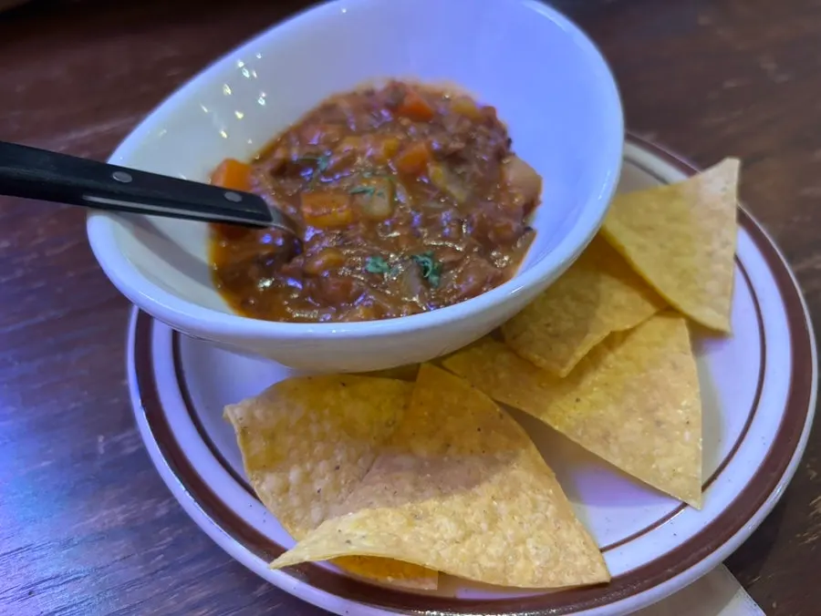 Dipping nachos into the sauce