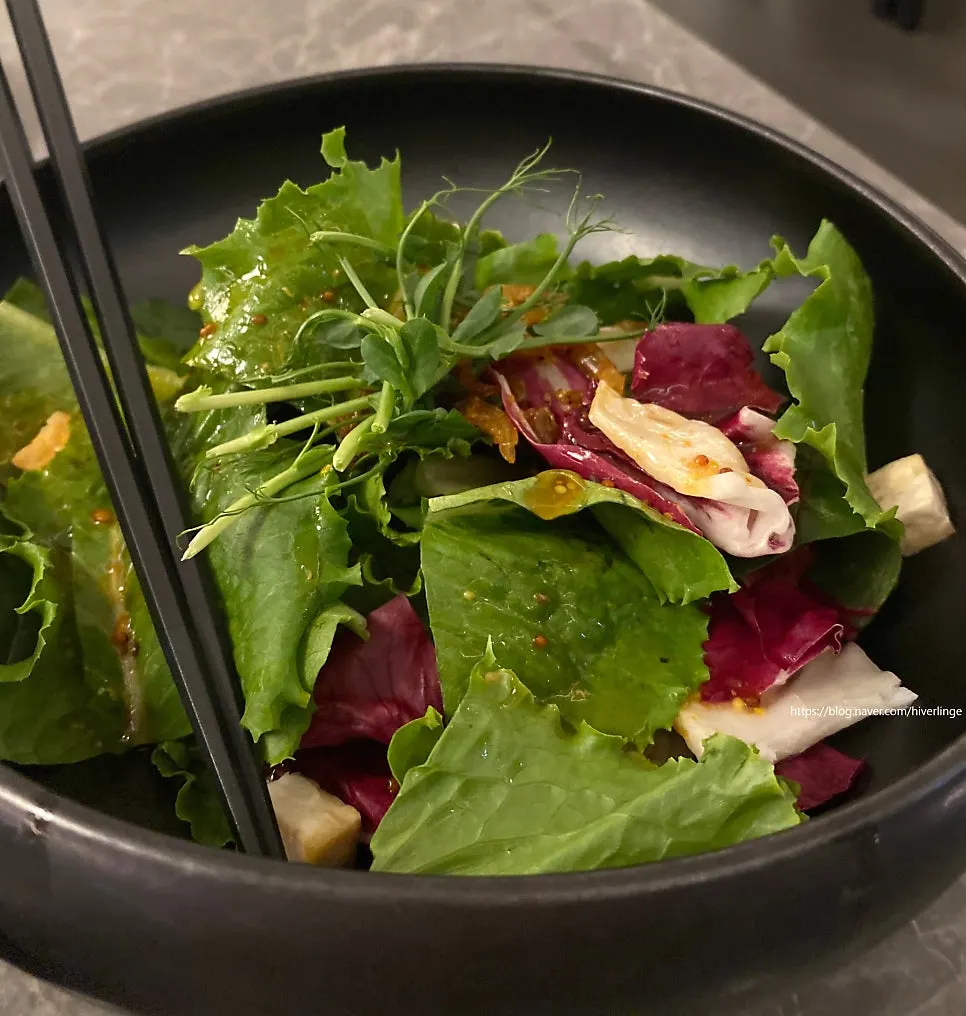 A generously plated salad dish