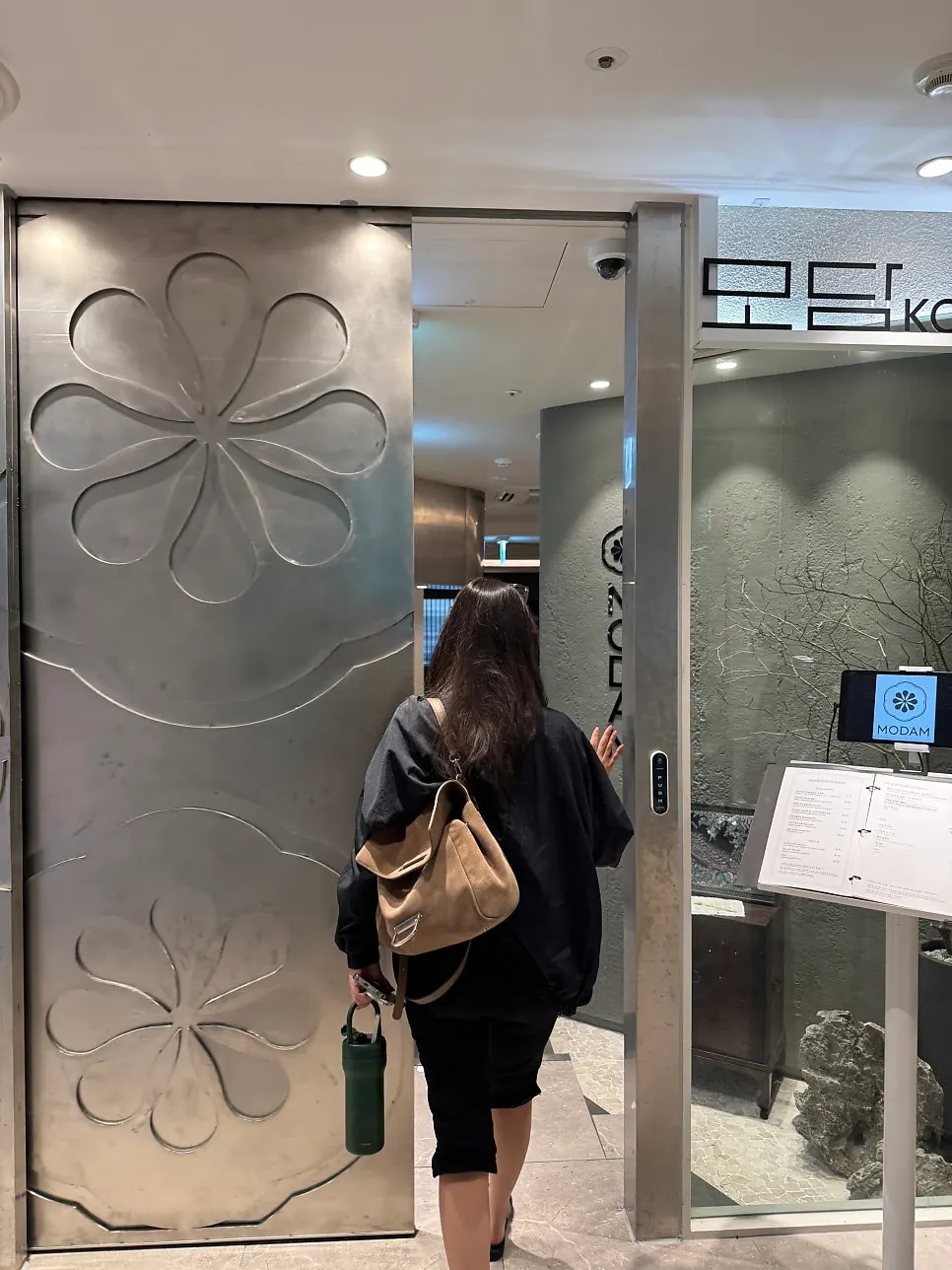 Modam Itaewon entrance in front of the large metal door