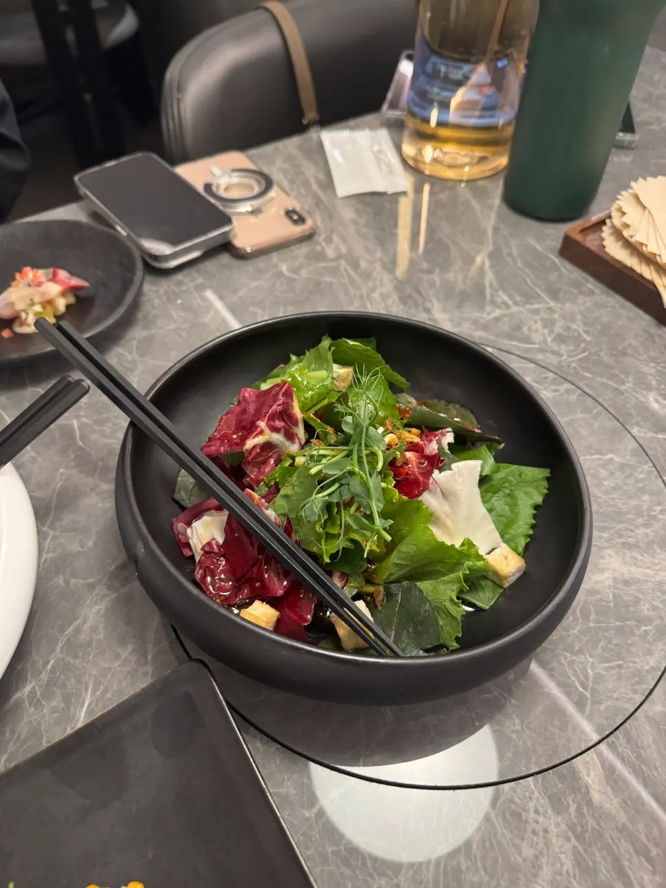 Fish carpaccio and vegetable appetizer plate