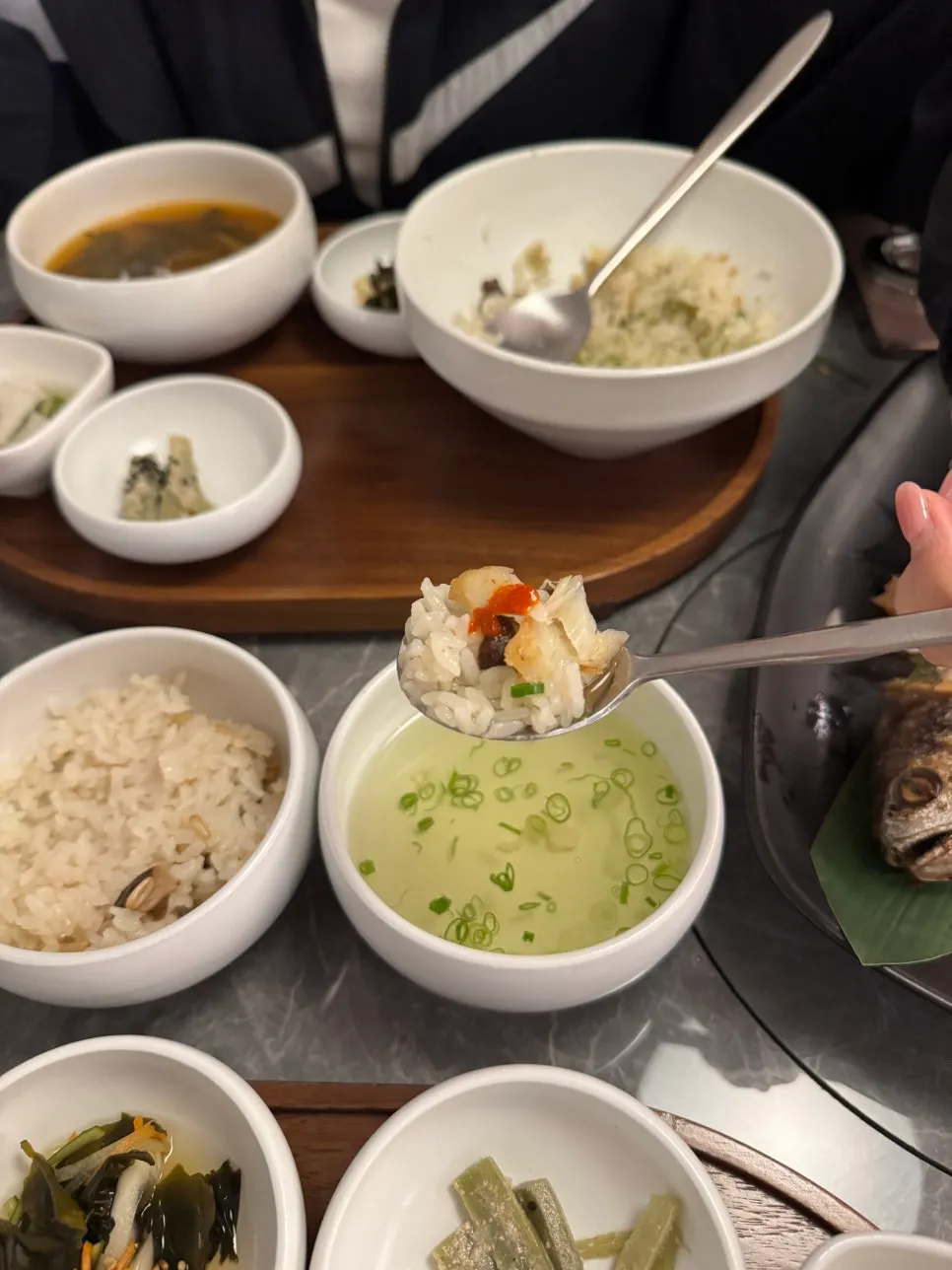 Rice soaked in green tea topped with a piece of corvina