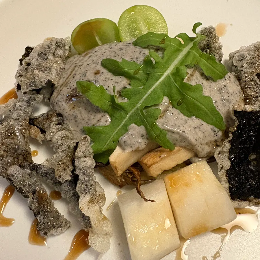 Black sesame salad served with shine muscat grapes and melon