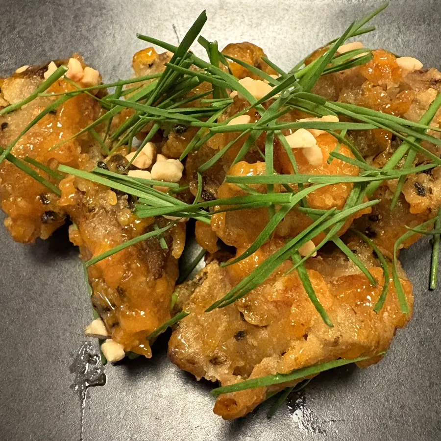 Shiitake mushroom sweet and sour topped with garlic chives and peanuts