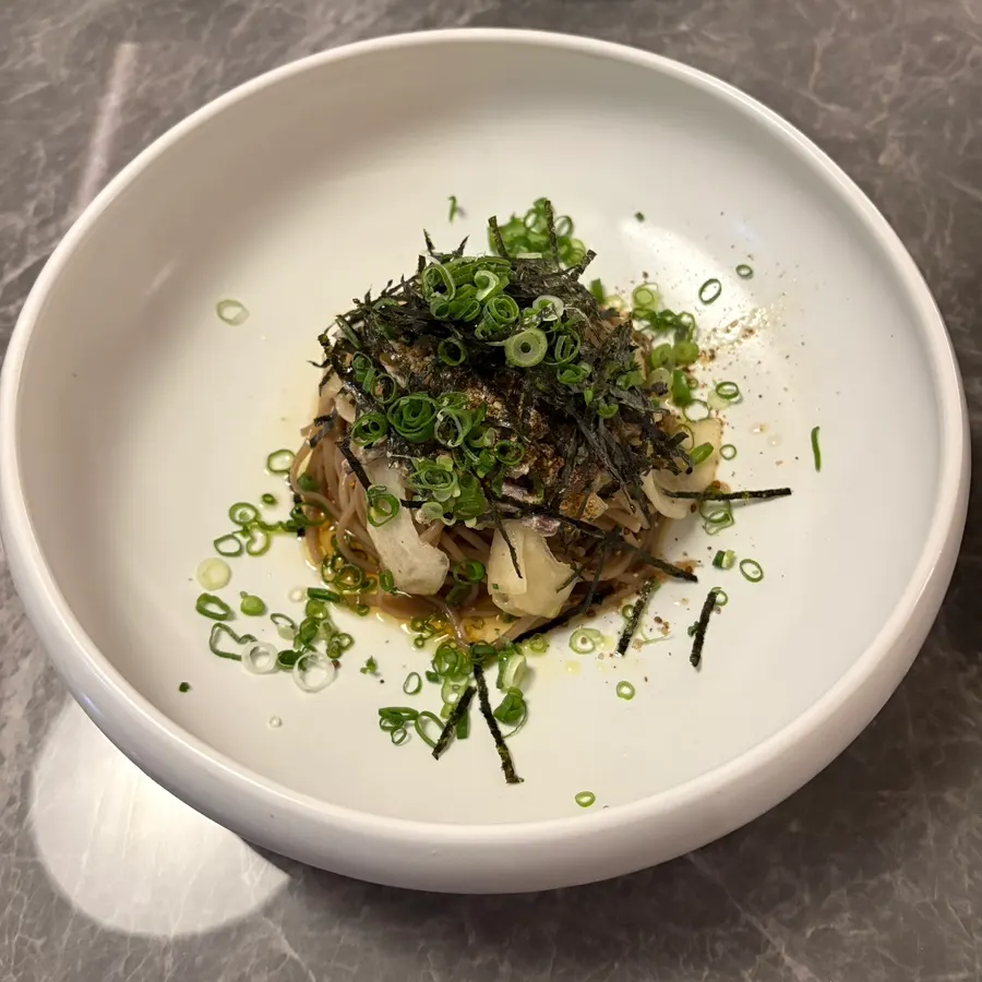 Perilla oil buckwheat noodles topped with bracken fern and melon