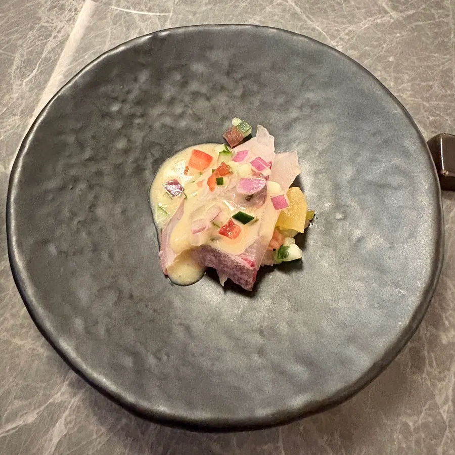 Amberjack ceviche topped with a fresh sauce