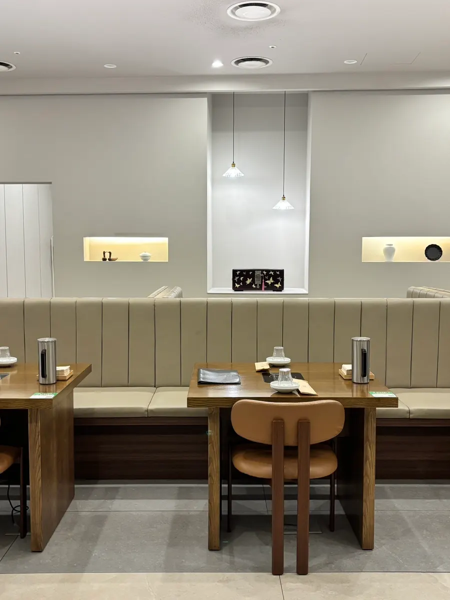 Ivory and wood-toned hall tables at Modam Urban