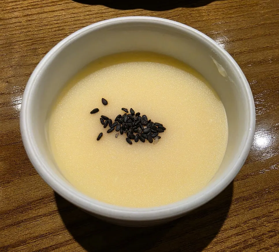 Mung bean porridge topped with black sesame appetizer