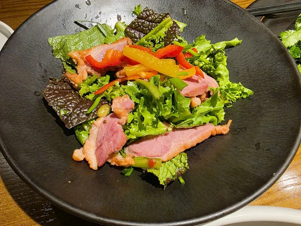 Cold salad appetizer with smoked duck