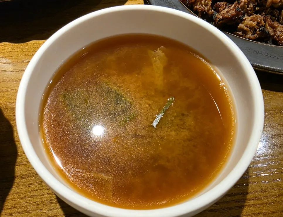 Warm soup served alongside the meal