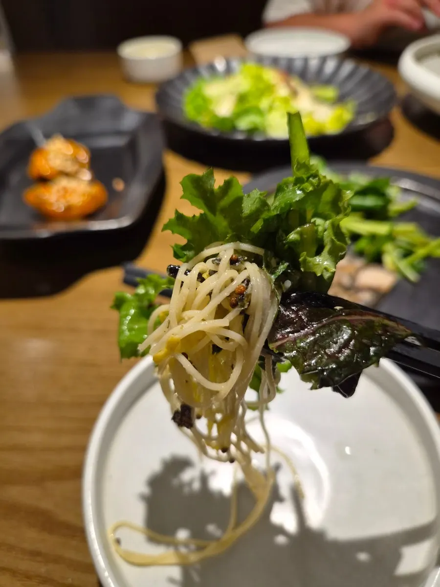 Side dishes and salad on the table at Modam Urban