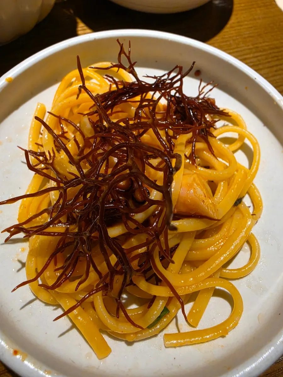 Sliced mushroom served with truffle chamnamul salad
