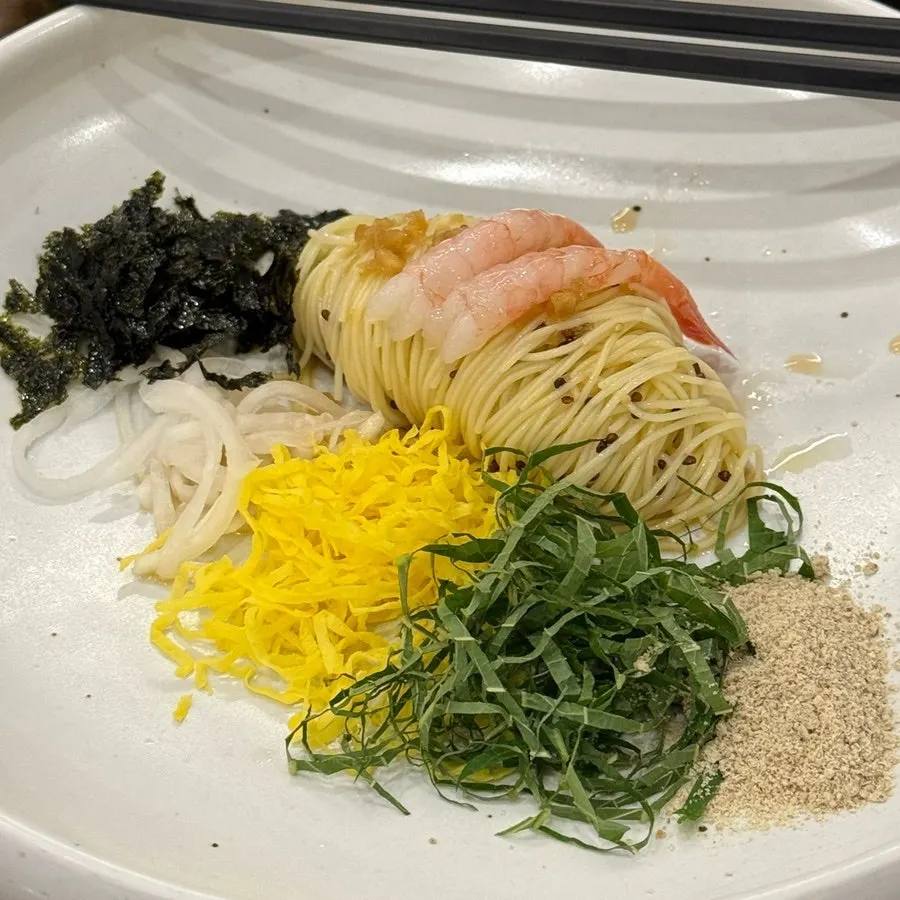 Perilla oil cappellini topped with garnishes