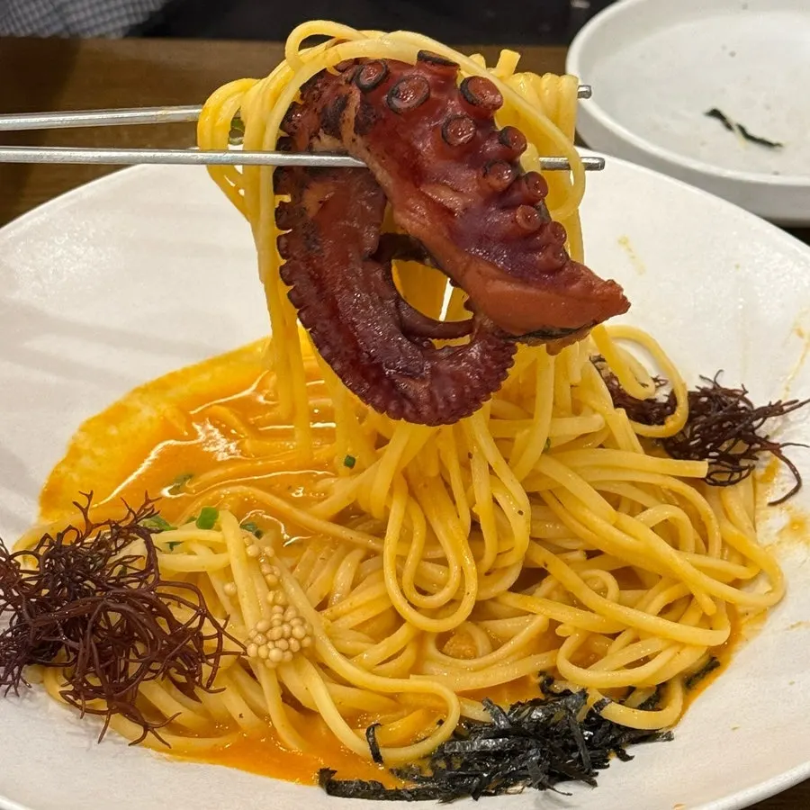 Crab-broth octopus pasta topped with octopus