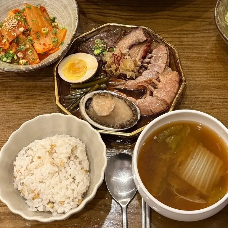 A spread of assorted seafood jang with gim butter rice