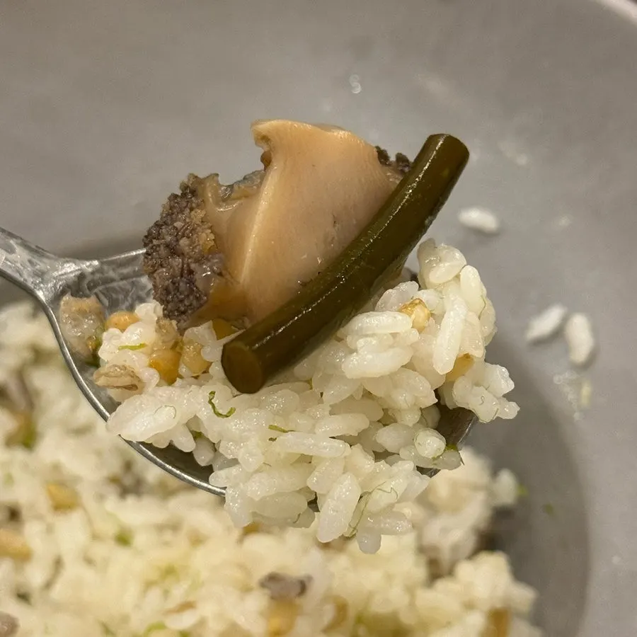 A spoonful of gim butter rice topped with seafood jang