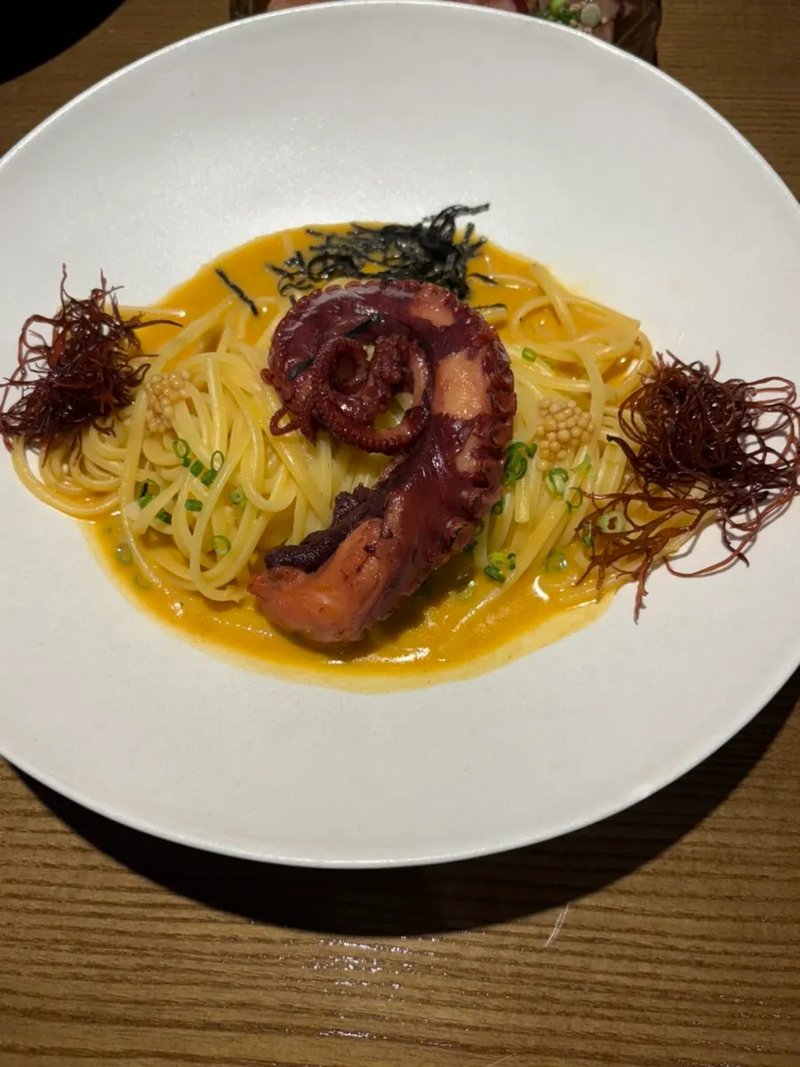 Pasta noodles coated in crab broth sauce