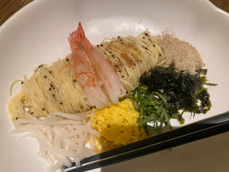 Perilla oil capellini topped with raw shrimp