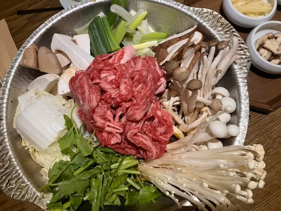Table with four basic side dishes and steamed rice