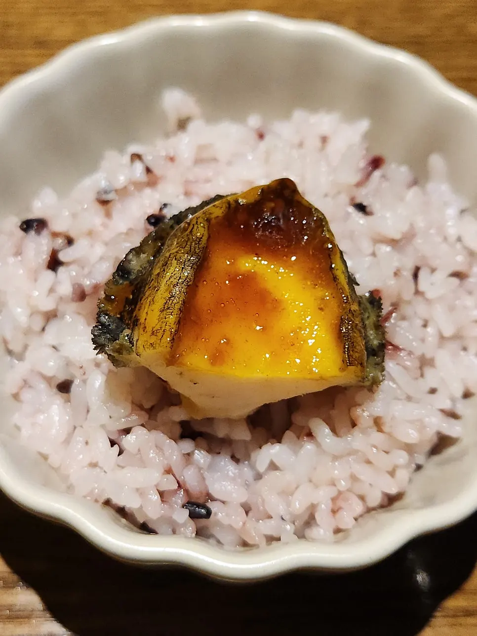 A spoonful of abalone over rice