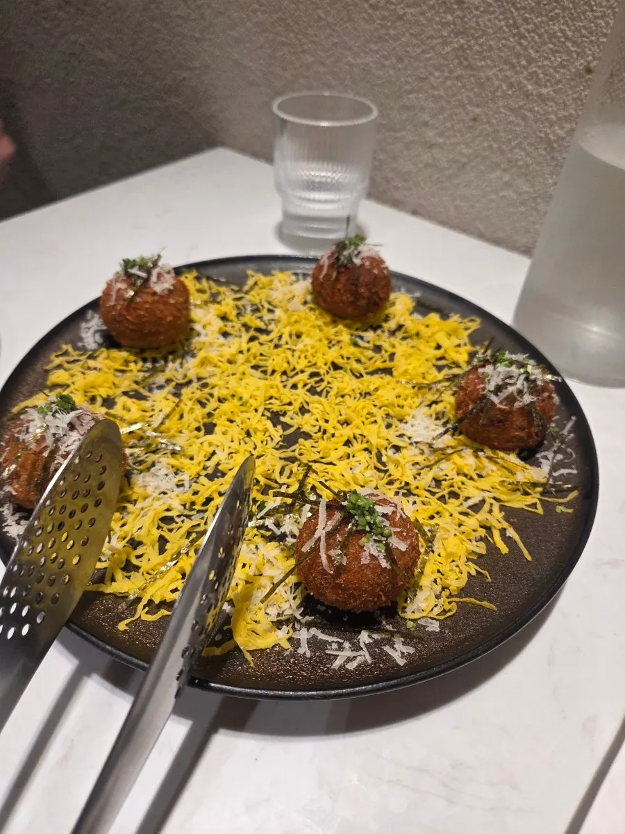 MOI's bibimbap arancini, plated as 5 pieces