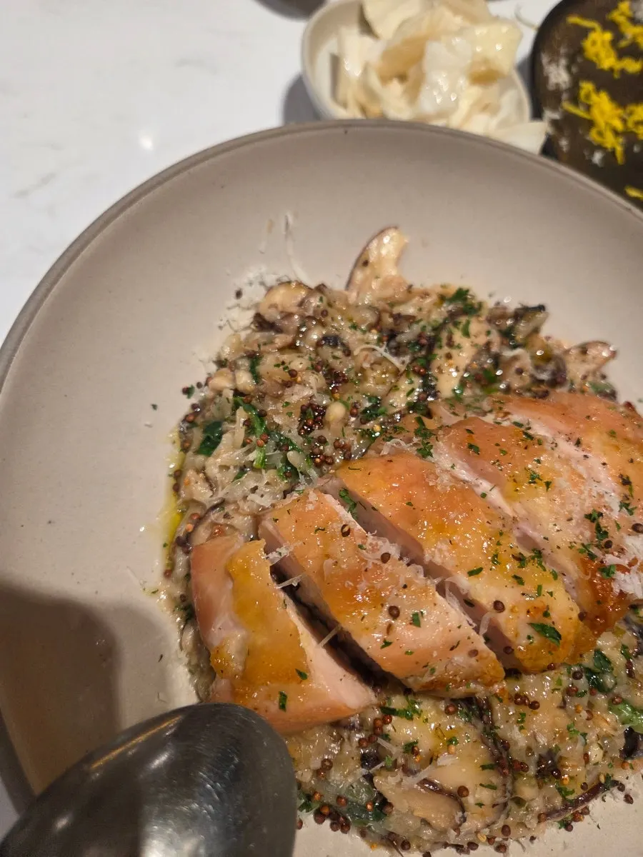 Chicken mushroom risotto topped with chicken thigh and mushrooms