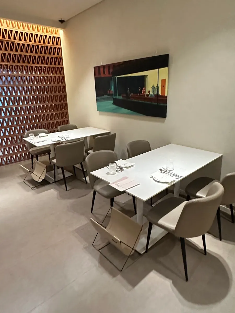 MOI's interior seating with white tones and wood accents