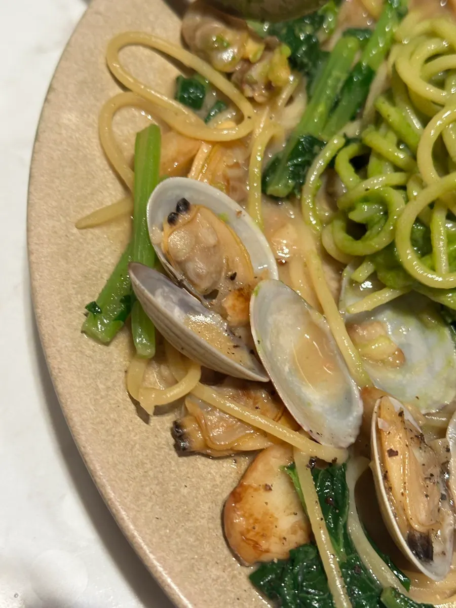 Vongole pasta topped with chamnamul pesto