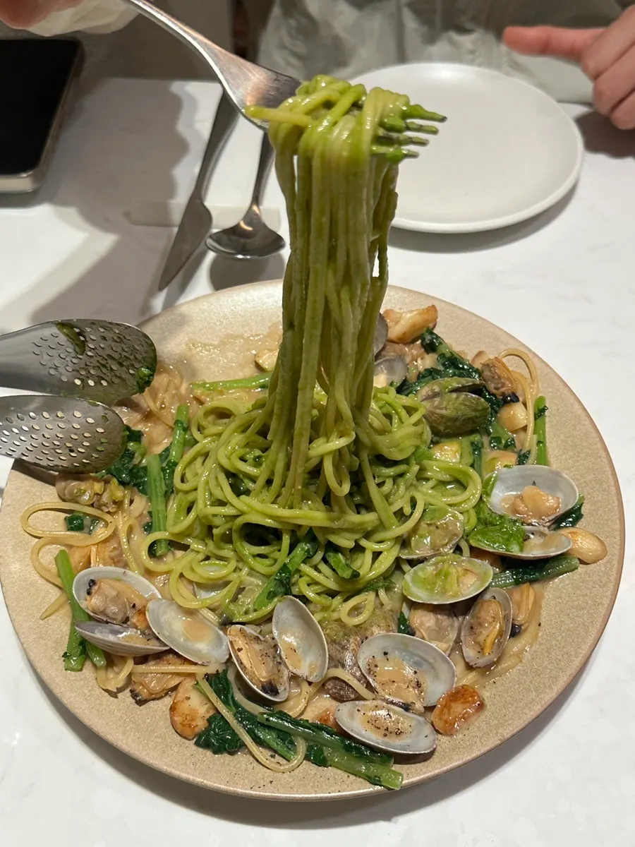 Chamnamul vongole pasta noodles wound on a fork