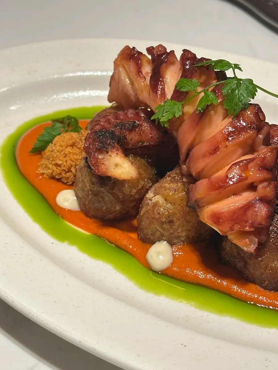 A plate of plump octopus and fried baby potatoes