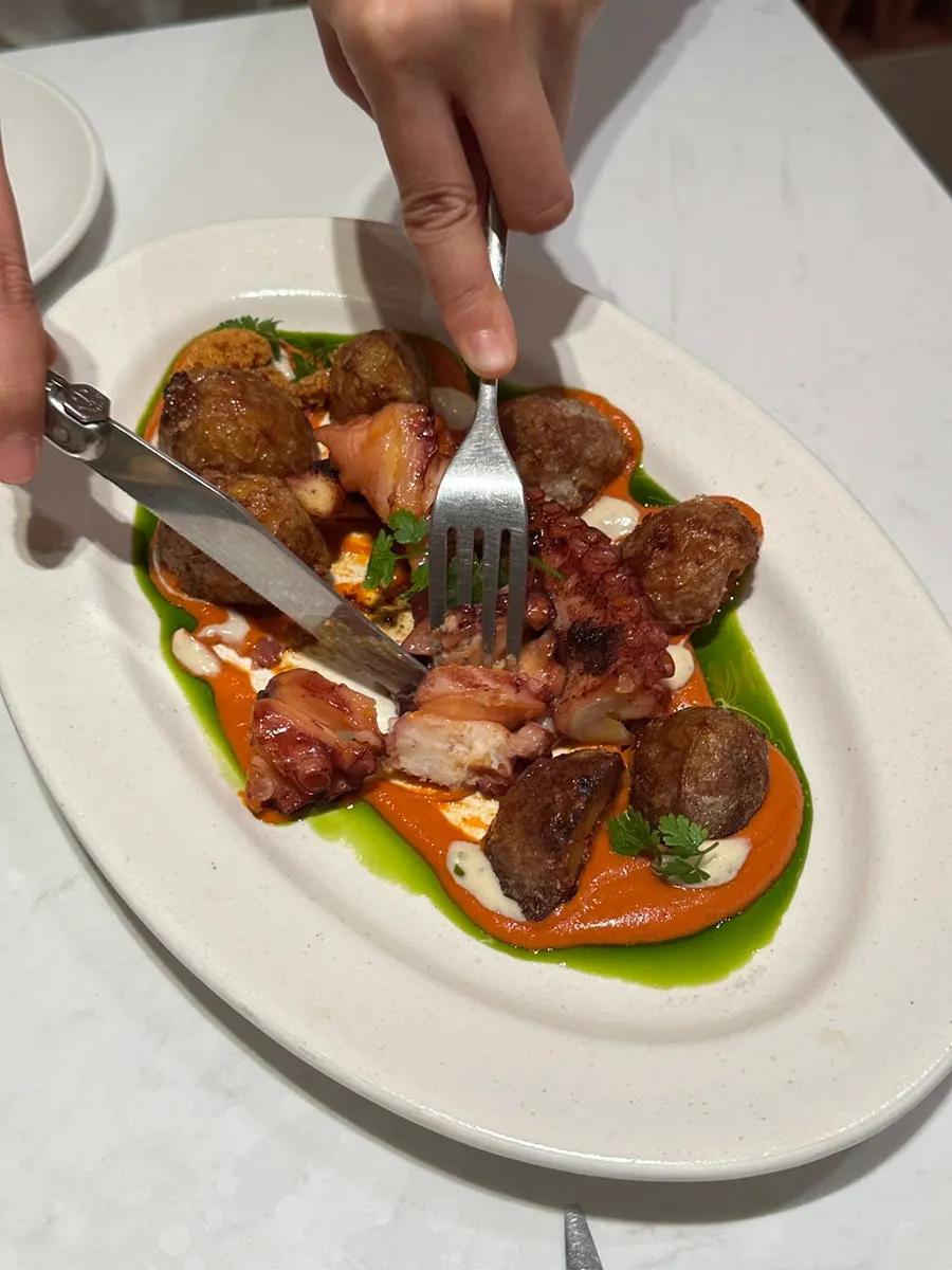 A bite-sized piece of octopus steak