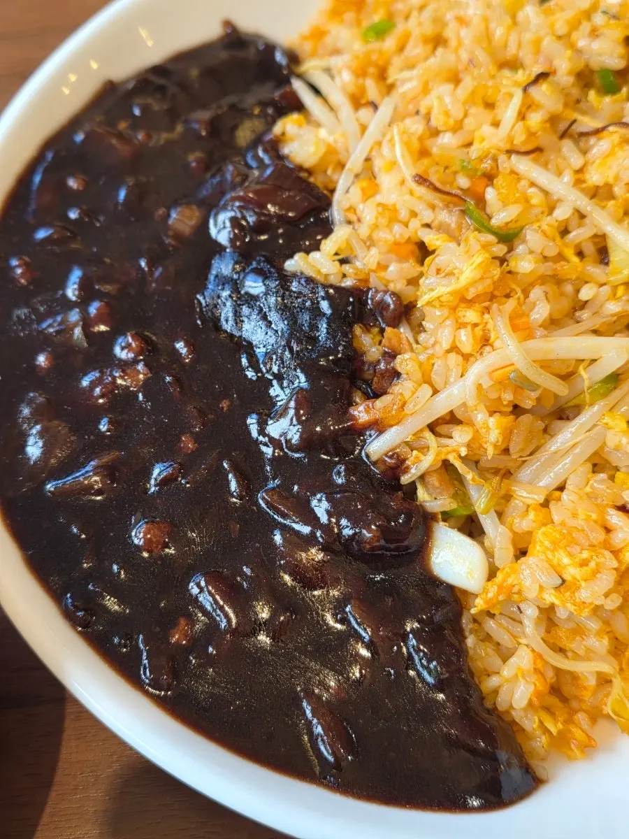 Seafood fried rice served with jjajang sauce