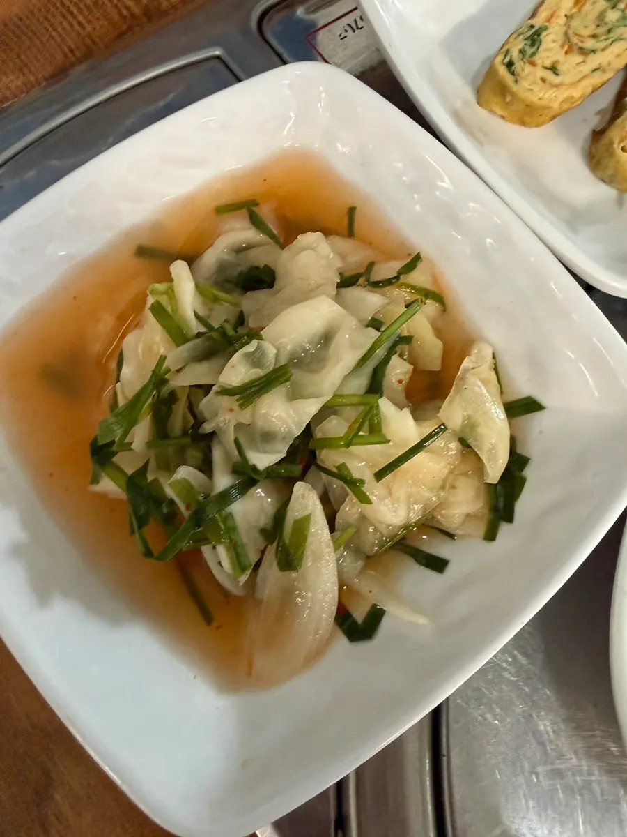 Plate of cabbage kimchi and other side dishes
