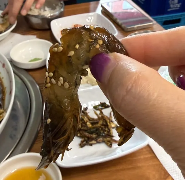 A peeled piece of soy-marinated shrimp