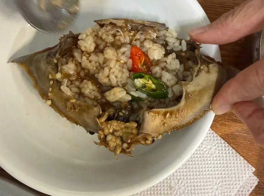 A spoonful of crab roe bibimbap