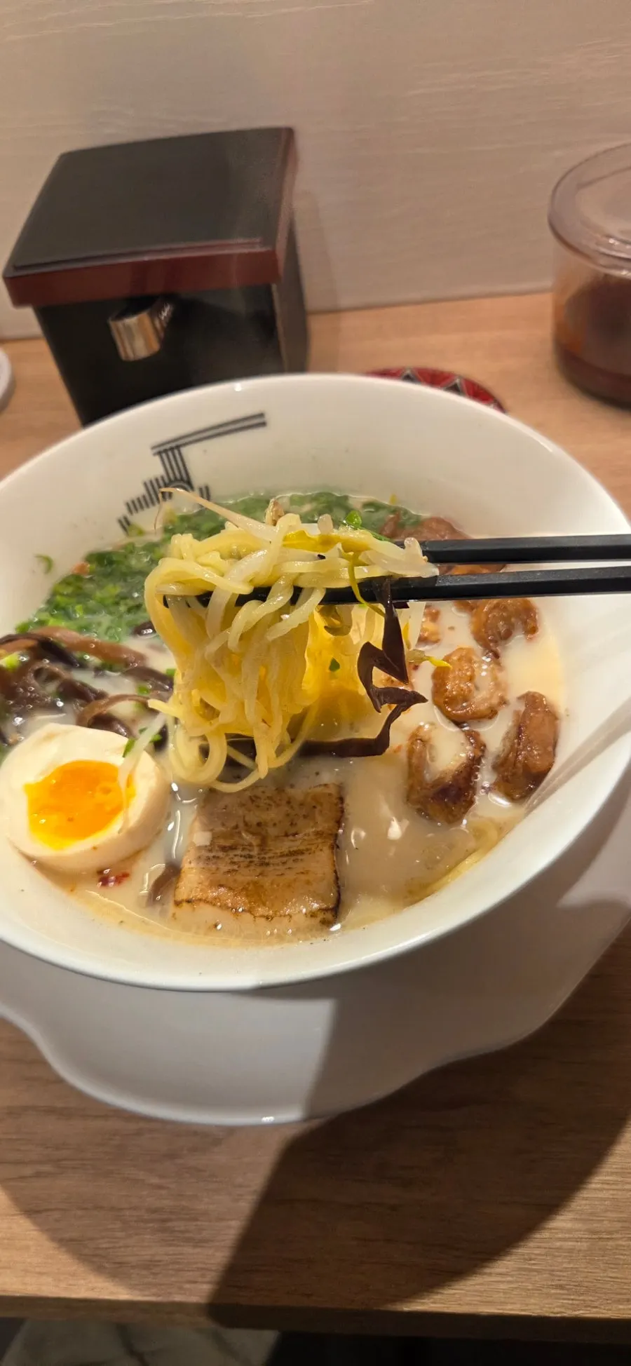Chashu and egg toppings on ramen