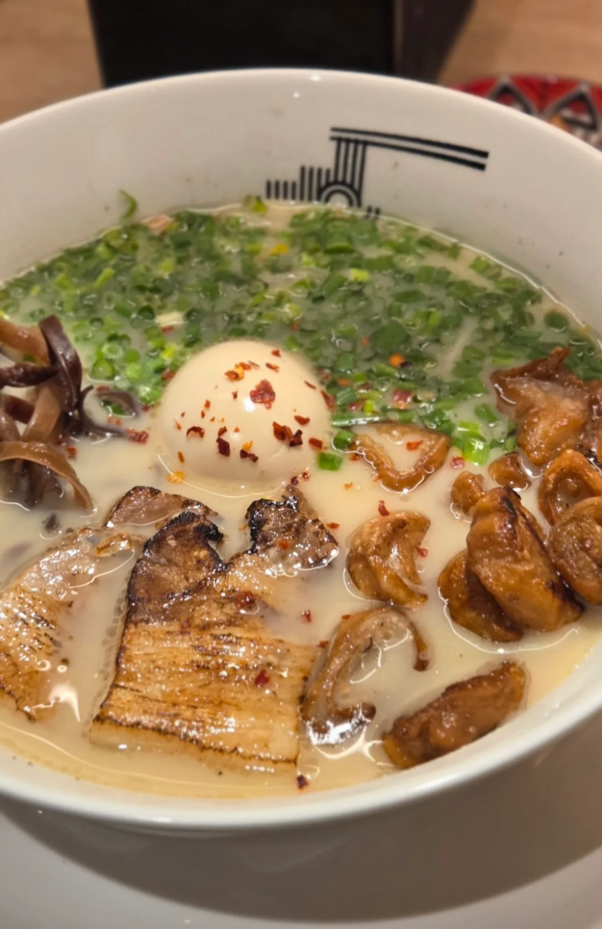 A bowl of fried pork intestine motsu ramen