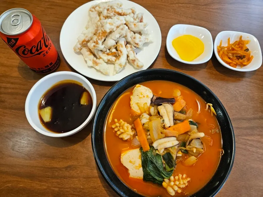 Sundubu jjampong and mini tangsuyuk served hot on the table
