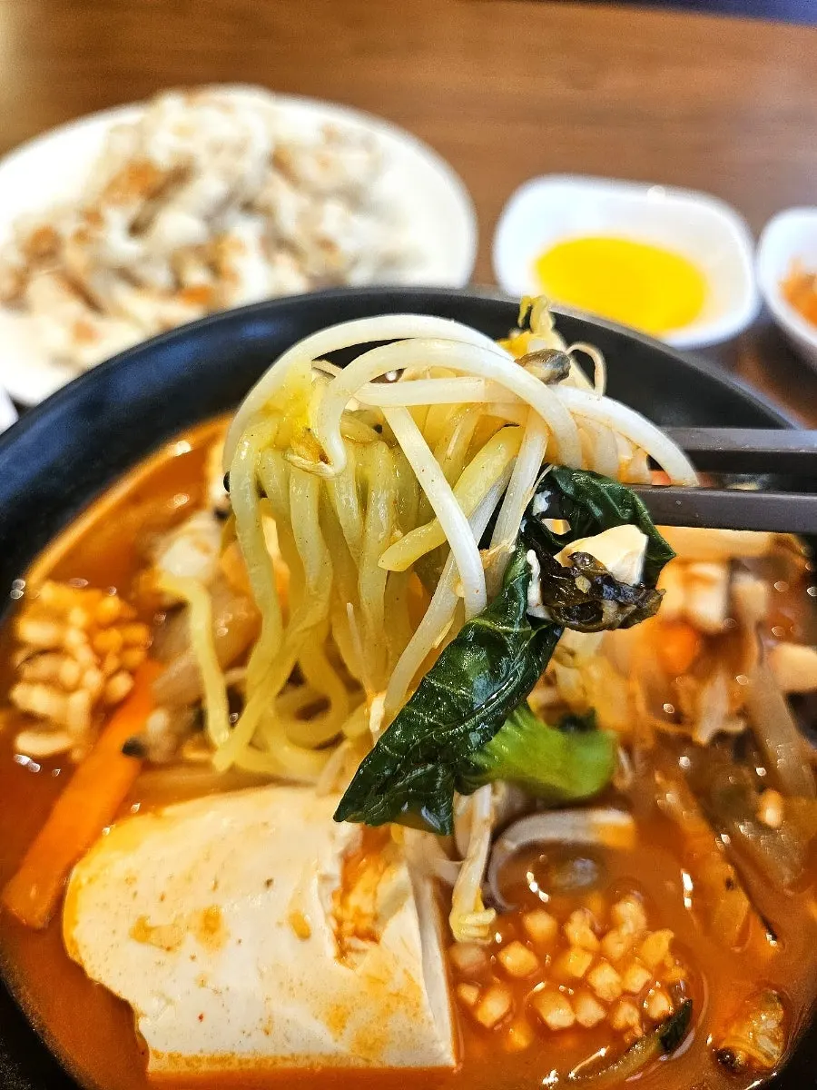 Noodles lifted from the sundubu jjampong broth