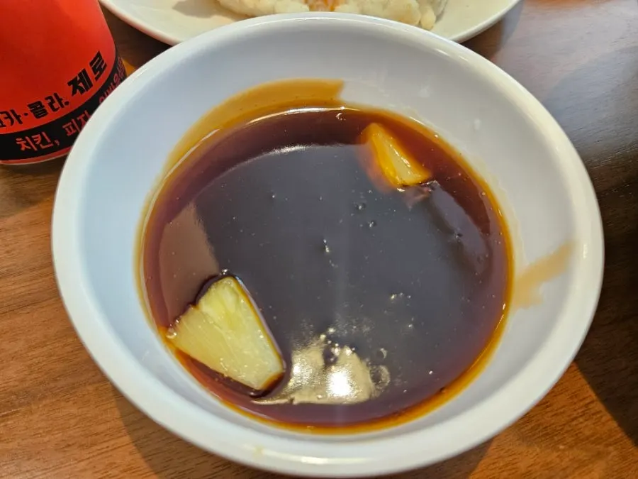 Mini tangsuyuk plate placed beside the sundubu jjampong