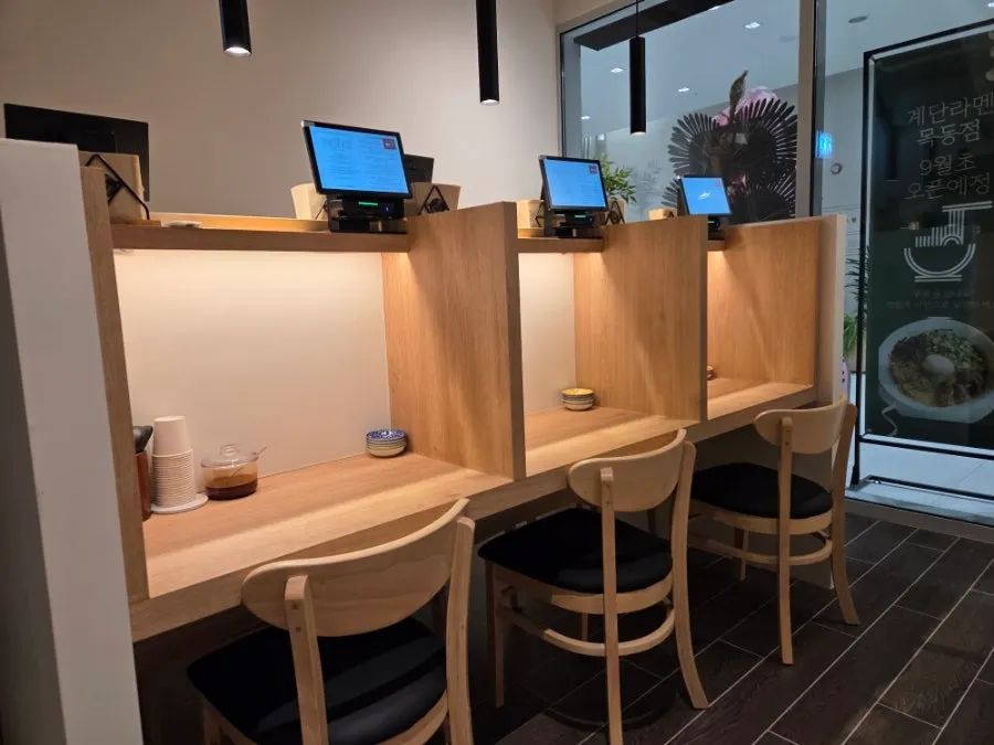Spacious dining hall with wood-toned interior seating