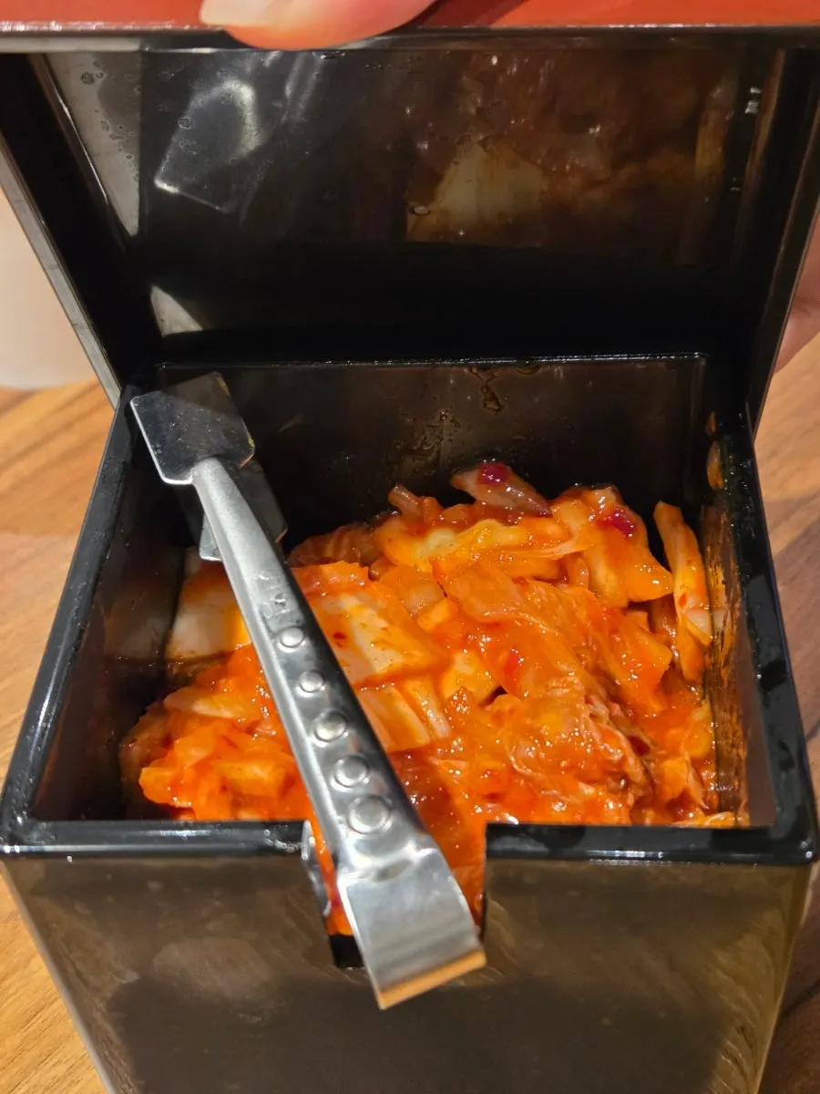 Vertical photo of an emptied ramen bowl