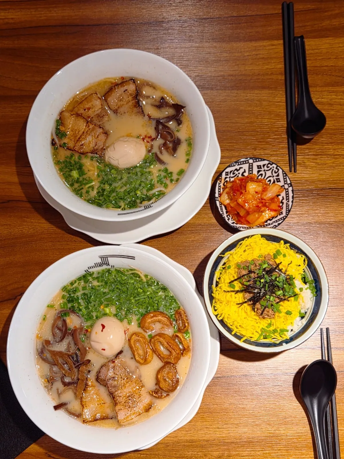 Table setting with both Gyedan Ramen and Motsu Ramen