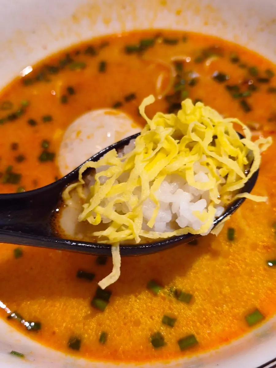 The complimentary rice served to mix into the leftover broth