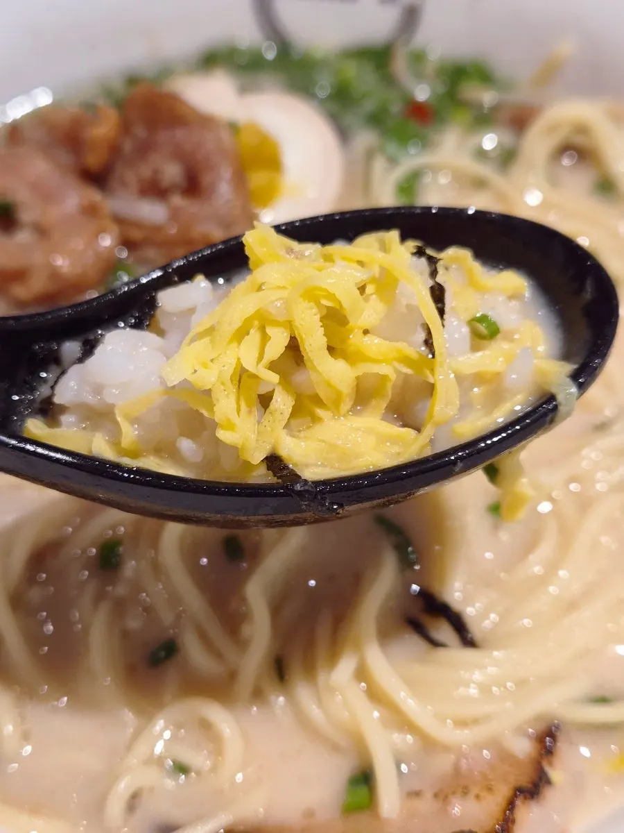 A final spoonful of the ramen broth and rice