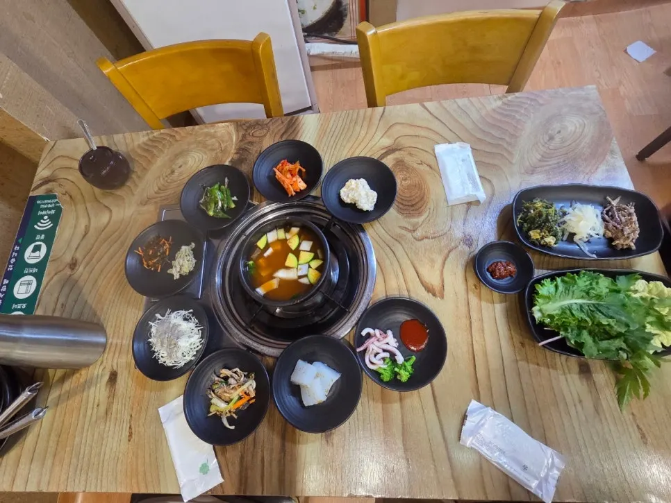 Banchan set up at the table where the baby is seated