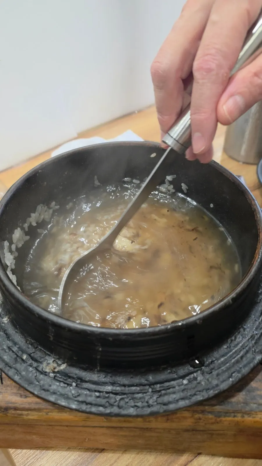 Doenjang jjigae simmering on the table burner