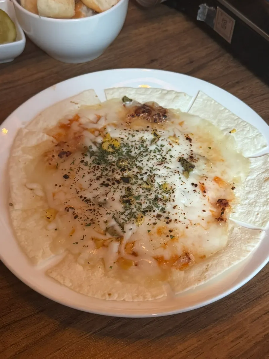 Cream cheese shrimp fondue covering the entire pan