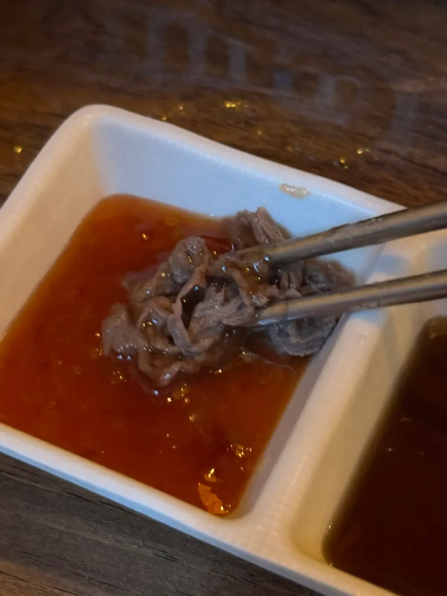 Chili sauce and soy sauce served with the mille-feuille nabe