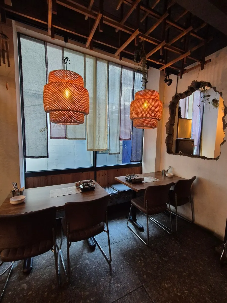 Greenhouse-style outdoor seating at Mokhwa Silbi