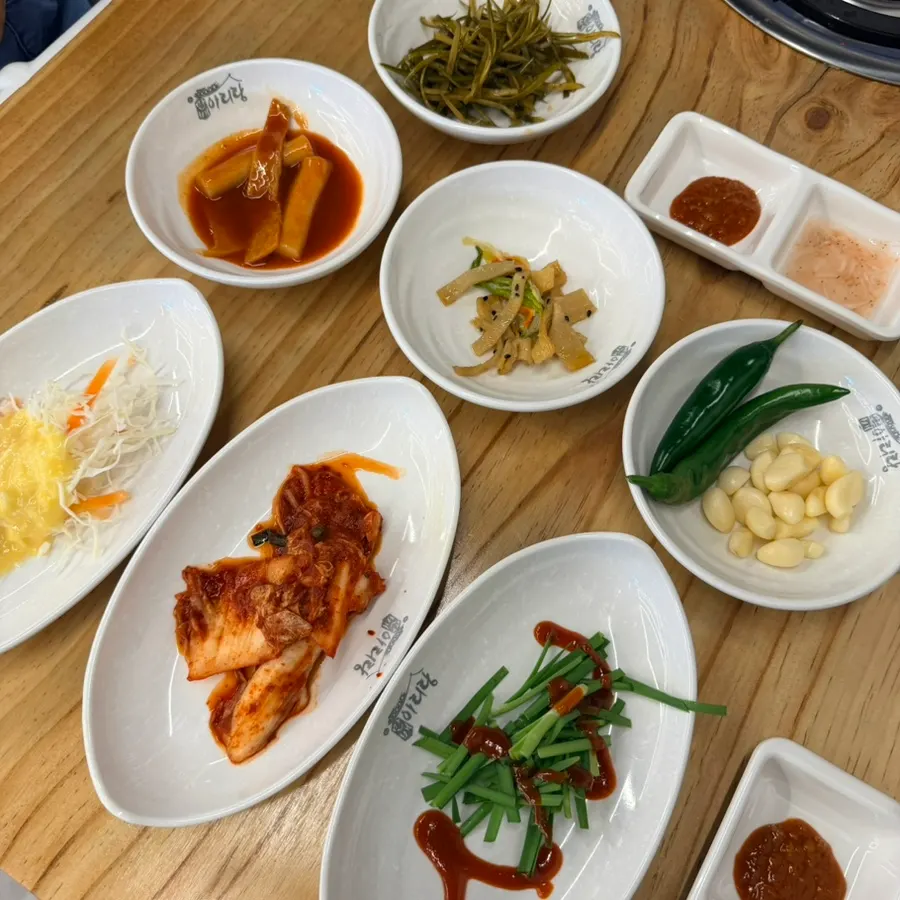 Table spread of basic side dishes served with the bossam